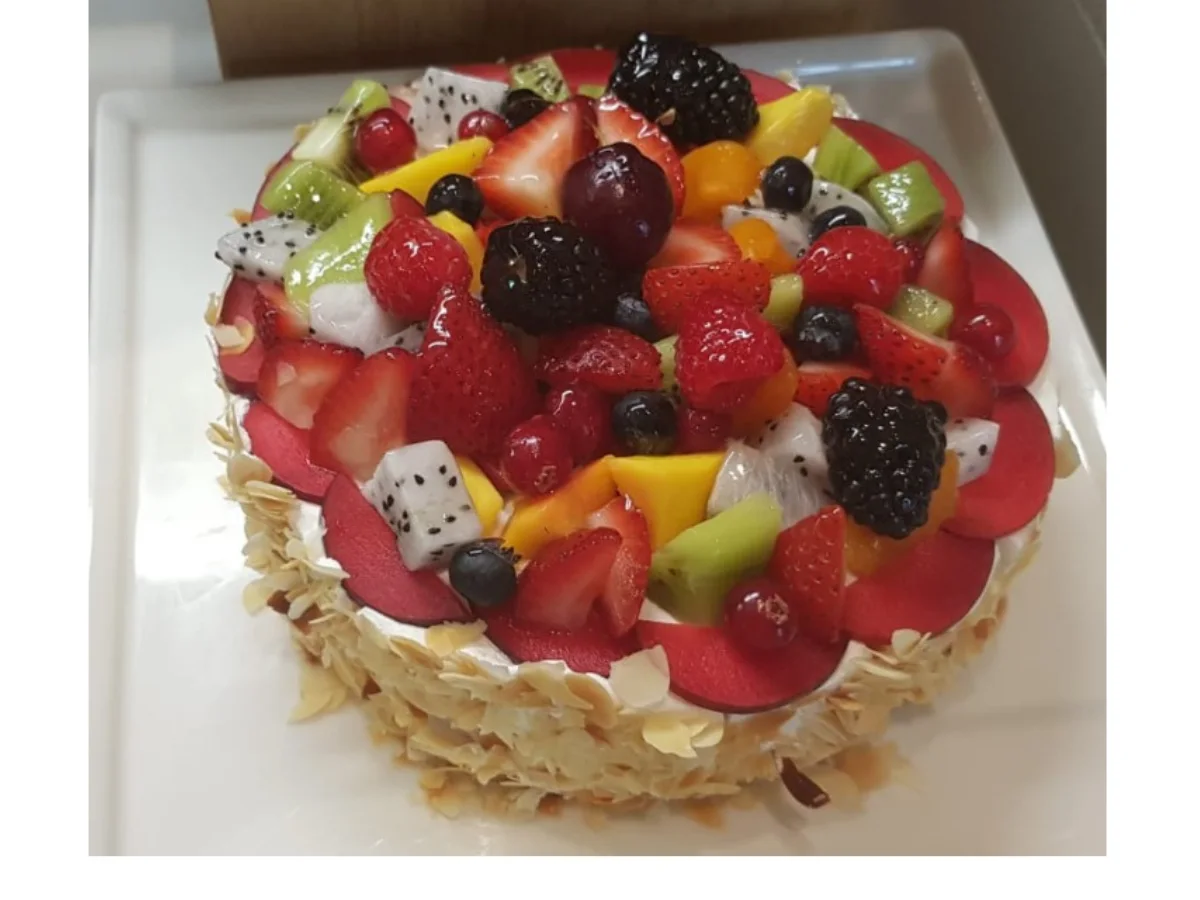 Fruit-topped cake inspiration Fruit-topped cake inspiration — illustrative culinary photography